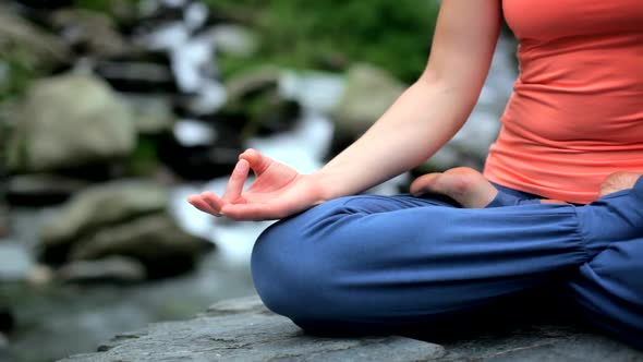 Close Up of Woman Doing Yoga Padmasana Lotus Pose alt
