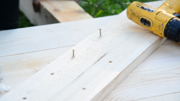 Working Spin Screw In Wooden Board