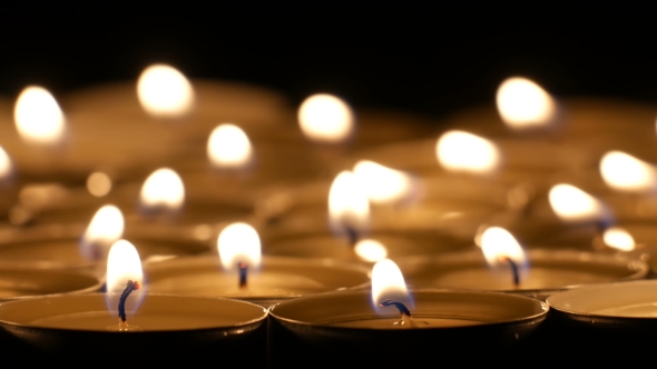 Tea Candles Burning At Night