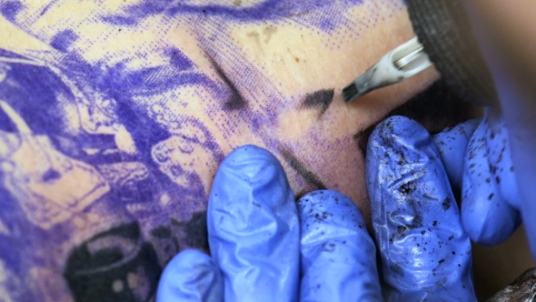 Artist Creating Tattoo alt