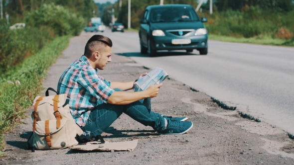 Man Sit At Road In Countryside