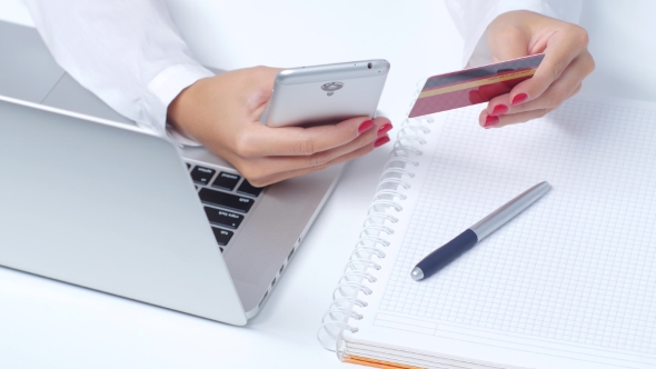 Girl Doing Shopping Online Via Mobile And Credit Card.  alt