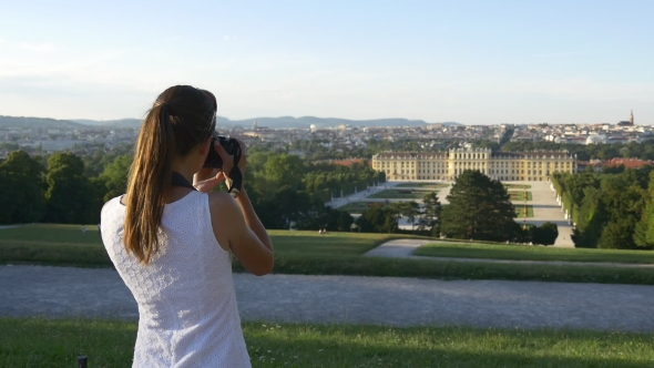 Woman Takes Picture Of Palace And Garden In Vienna
