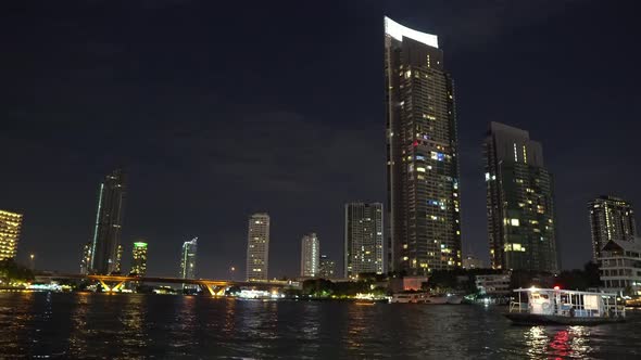 corporate buildings on the river bank with offices in bangkok alt