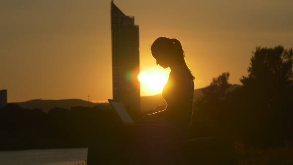 Skyscraper, Sun And Girl With Laptop