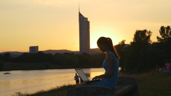 Silhouette Of a Woman With a Laptop