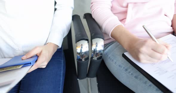 Group of People Fills Out a US Visa Application Form alt