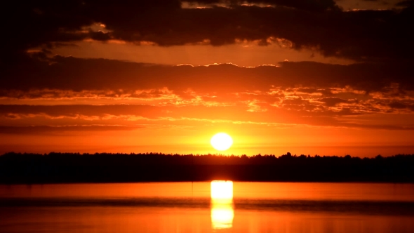 Scenic Sunrise Over Water With Beautiful Sky