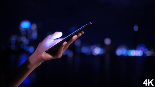 Using Smartphone In City Night alt