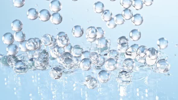 Super Slow Motion Shot of Hydrogel Balls Bouncing on Glass at 1000Fps alt