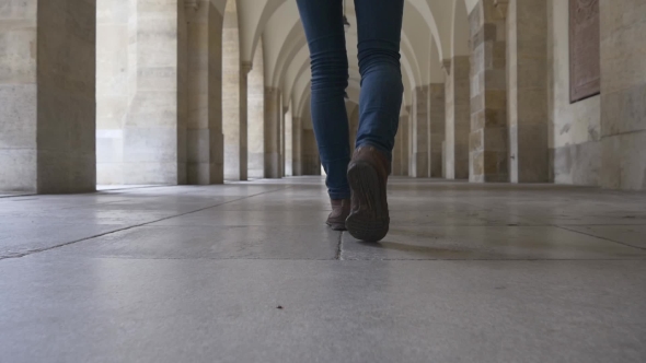 Women's Feet Go Through The Hall Of Columns