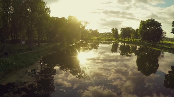 Flying Over Lake On Sunset