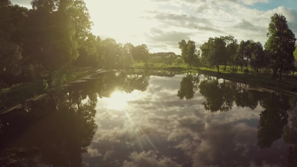 Flying Over Lake On Sunset