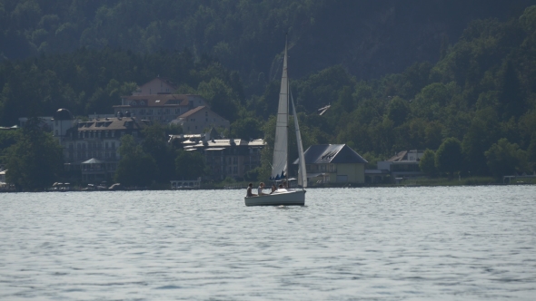 Boat Sailing in Mountain Lake