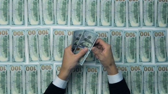 Unrecognizable Man Hands Counting Cash. Hundred New US Dollar Banknotes. alt