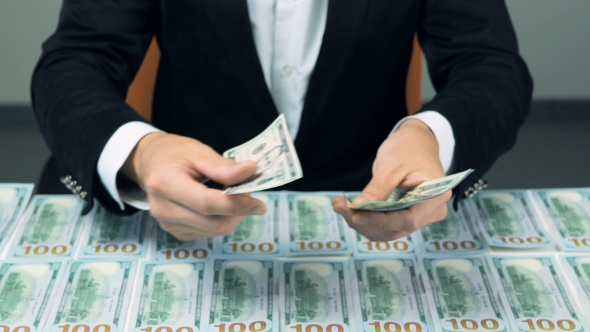 Unrecognizable Man Hands Counting Cash. Hundred New US Dollar Banknotes. alt