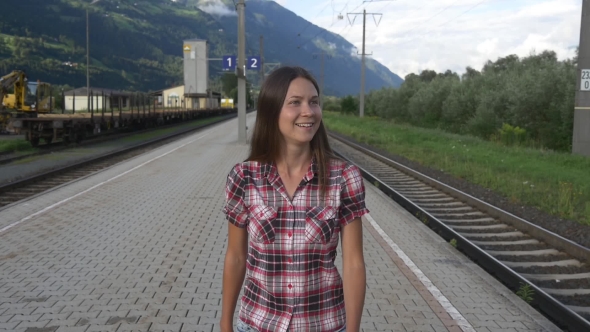 Cheerful Woman On Platform Arrived To Hometown