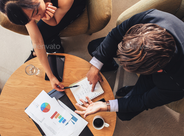 Coworkers discussing new business project - Stock Photo - Images