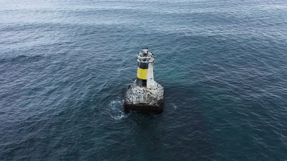 Aerial view of lighthouse in the sea