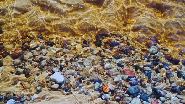 Background of Stones at the Bottom of a Stream in Spring