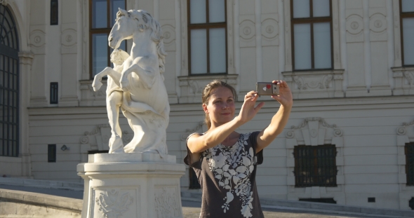 Selfie On The Background Of The Horse Statue