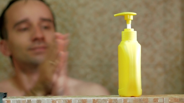 A Man Taking a Shower At The Hotel. He Pours Shampoo In Hand, Soaps Head