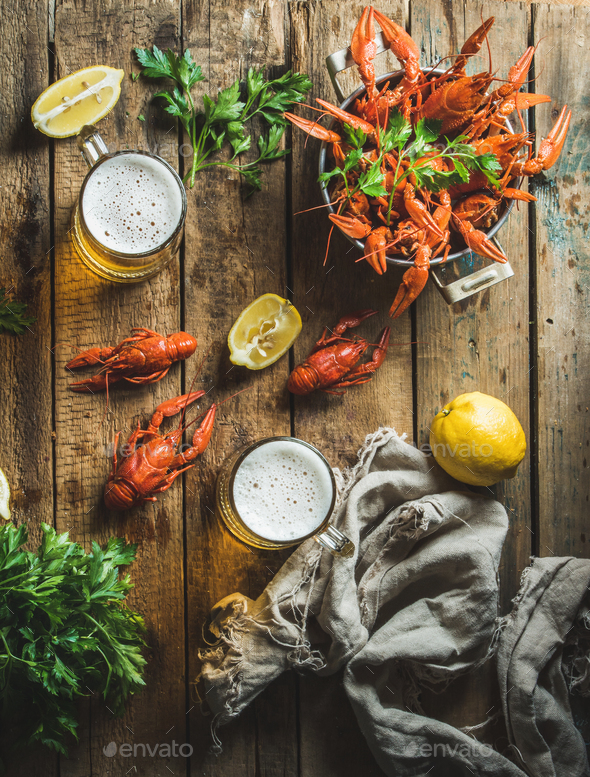 Wheat beer and boiled crayfish with lemon, parsley