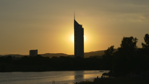 High-rise Building Glows As The Sun Goes Behind It