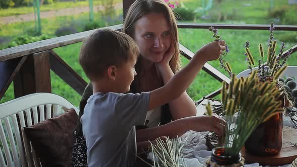 Mother and Son Making Decorative Flower Pot
