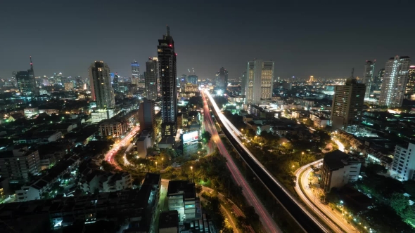 Shot Of Night Life In The Big City, Lighted Skyscraper, Traffic, Intersection, Bangkok, Thailand alt