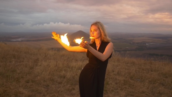 Woman Playing With Fire in Her Hands