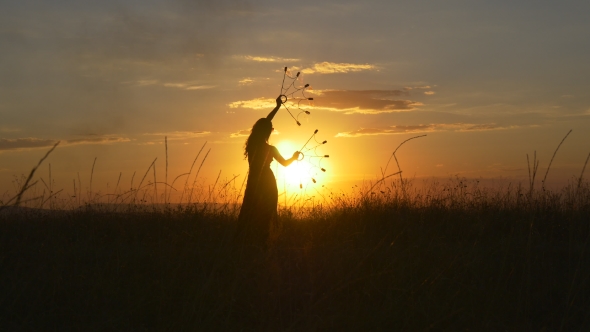Woman Is Spinning Fire At Sunset
