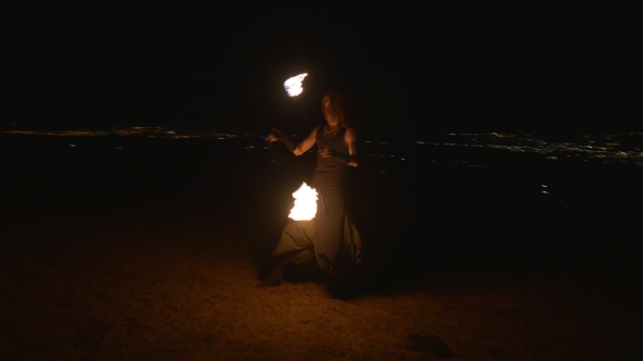 Fireshow Performance With Burning Torch At Night