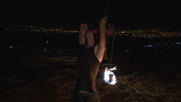 Artist Juggling With Burning Pois At Fire Show