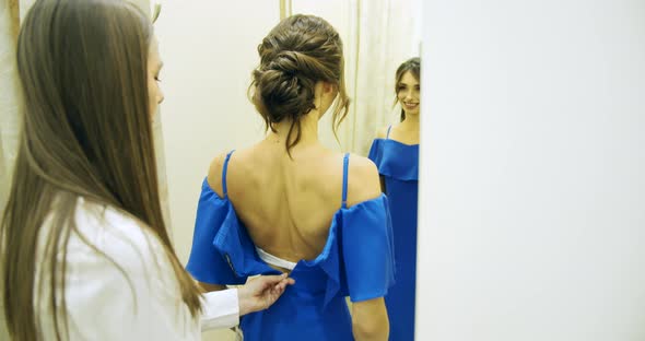 Woman in Dress in Fitting Room