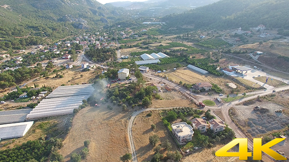 Greenhouse And Fields In Village
