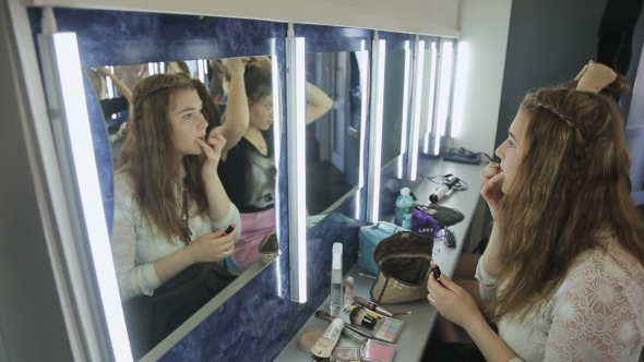 Up View Of Young Female Making Up In Model School.