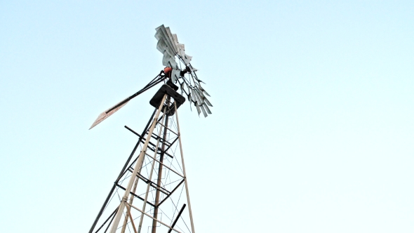 Farm Windmill Against Skies alt