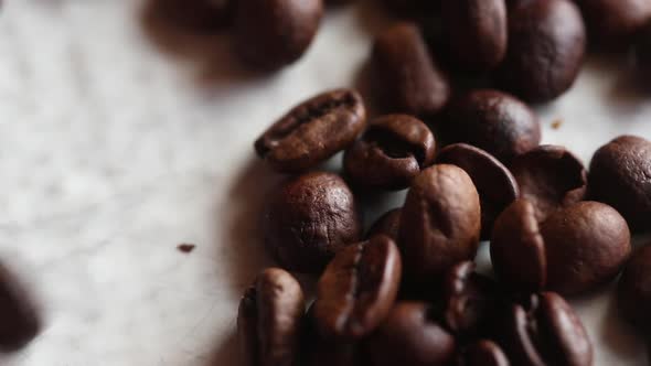 Man holding coffee beans, close up