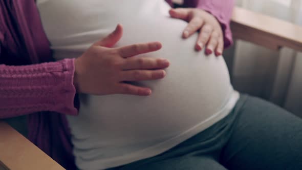 Happy Pregnant Woman and Expecting Baby at Home alt