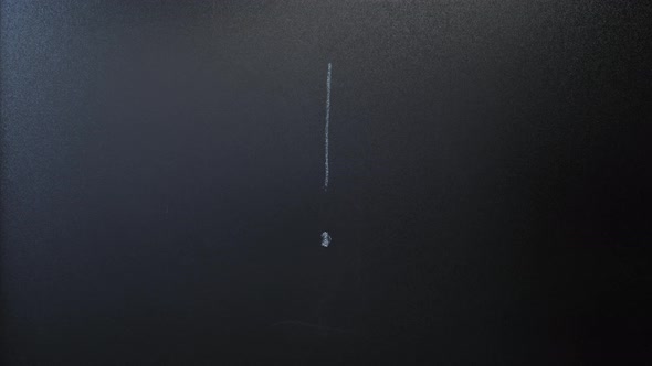 Writing exclamation mark with chalk on blackboard. alt