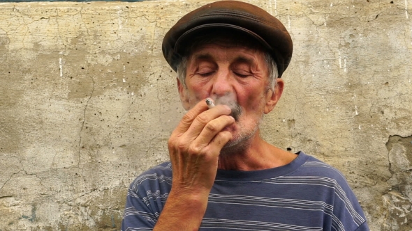 Footage a Man at the Age of Smoking a Cigarette alt