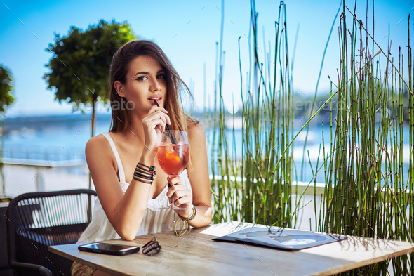 Girl drinking cocktail