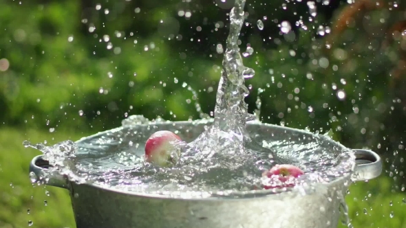 Apple Splashing Into Water In