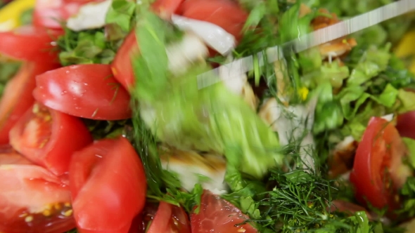 Woman Tossing Green Salad