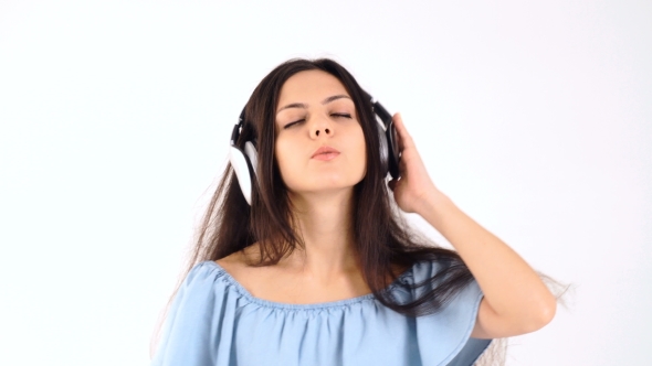 Woman in Headphones Listening Music