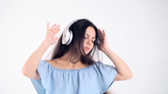 Woman In Headphones Listening Music