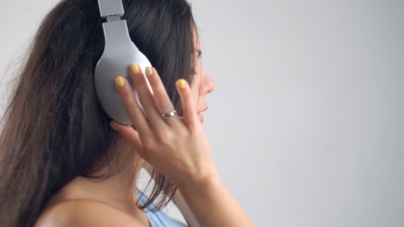 Woman In Headphones Listening Music