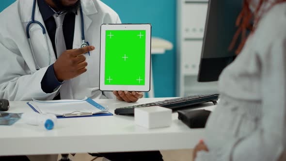 Male Obstetrician Using Greenscreen Template on Tablet Display alt