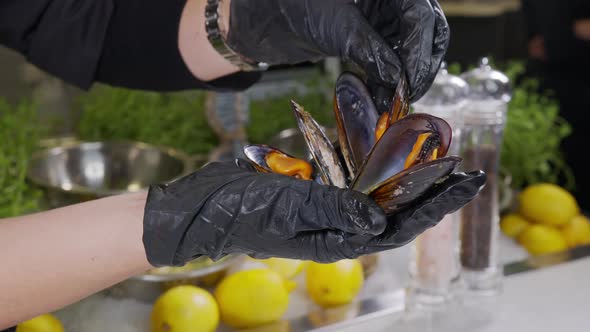 Slow Motion: Chef Cooking Paella with Shrimp, Mussel, Rice, Tomato, Spice, Saffron in Huge Paella alt